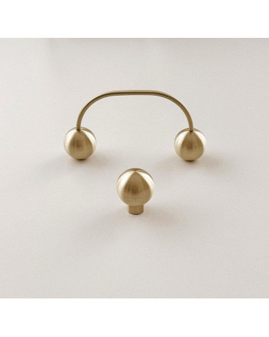 Brass Ball furniture knob design handle front view with a handle in the background