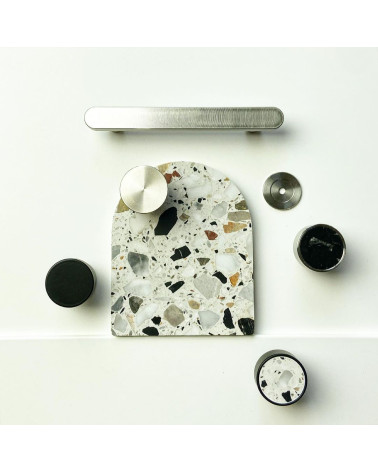 Black stainless steel furniture knob designer handle top view placed with other knobs