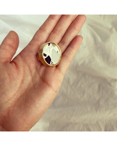 Brass and Terrazzo furniture knob designer handle presented on a hand