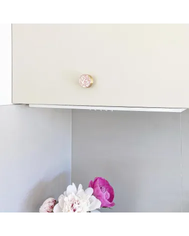 Brass and Pink Terrazzo furniture knob designer handle fitted on furniture with pink flowers at the bottom