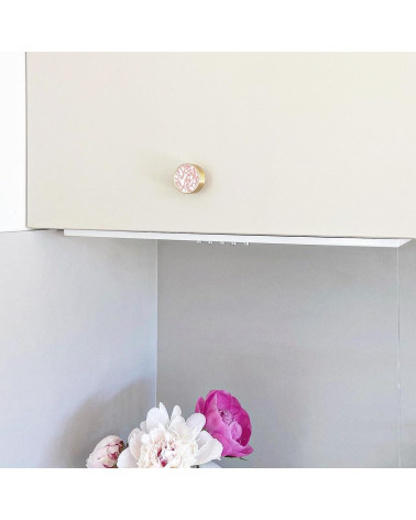 Brass and Pink Terrazzo furniture knob designer handle fitted on furniture with pink flowers at the bottom
