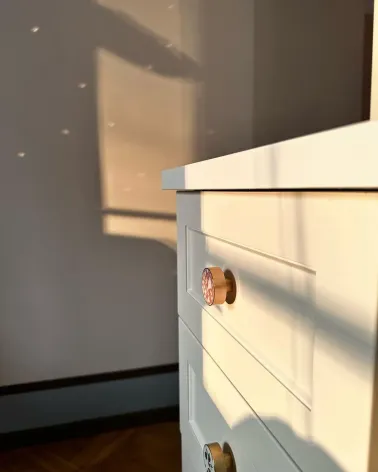 Brass and Pink Terrazzo furniture knob designer handle fitted on a drawer in natural light