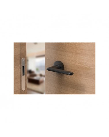 Black Spark designer door handle top view mounted on a door