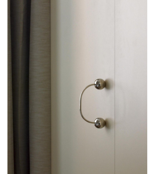 Brass furniture handle 10 designer handle top angled view fitted on a drawer