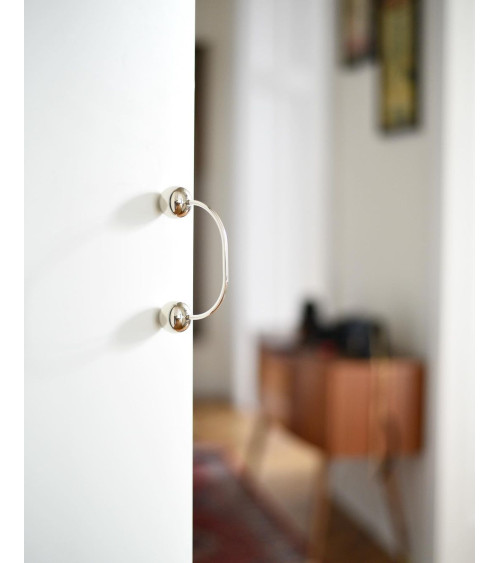 Brass furniture handle 10 designer handle top angled view fitted on a drawer