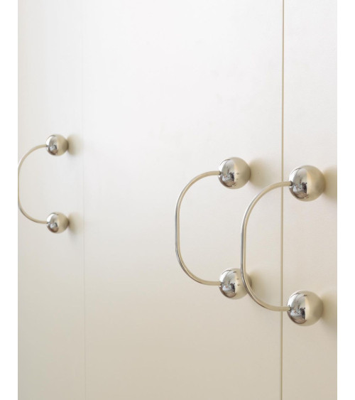 Brass furniture handle 10 designer handle top angled view fitted on a drawer
