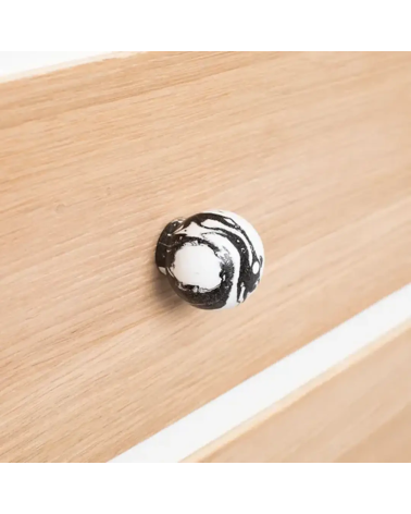 Black beech wood furniture knob designer handle side view on a wooden board