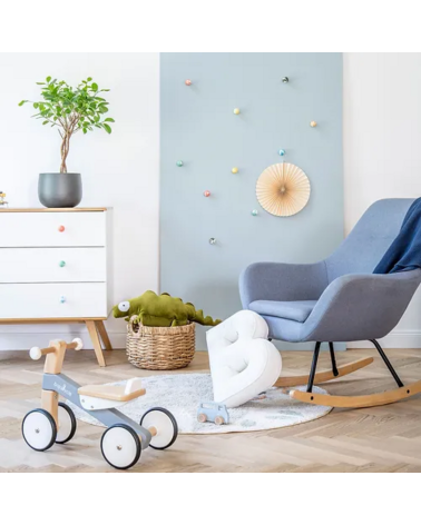 Octopus beech wood furniture knob designer handle installed on a white chest of drawers topped with a potted plant