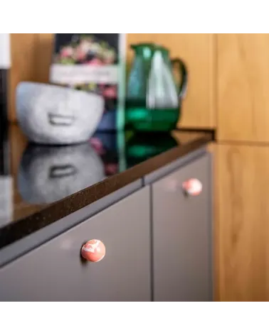 Cherry red beech wood furniture knob designer handle installed on a kitchen cabinet door