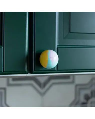 Funky yellow beech wood furniture knob designer handle close-up view installed on furniture