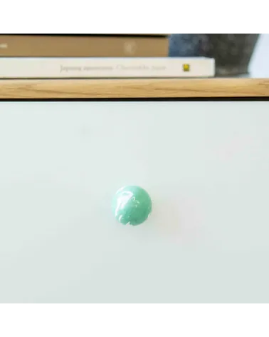 Rich green beech wood furniture knob designer handle front view mounted on a piece of furniture