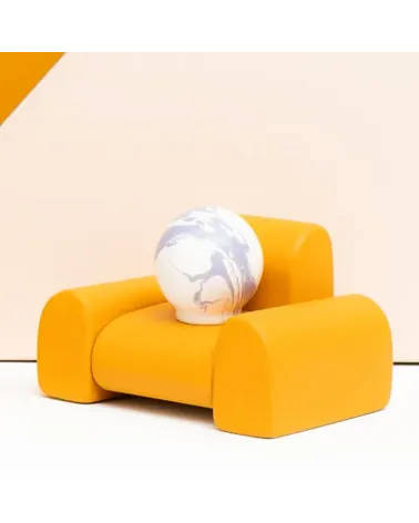 Lavender beech wood furniture knob designer handle placed on a small sofa