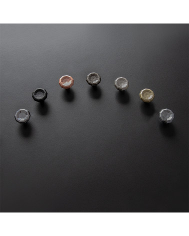 CAMPANA furniture knob designer handles arranged in an arc on a black surface