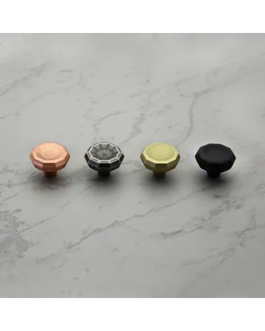 CAMPANA furniture knob designer handle aligned on a light marble surface