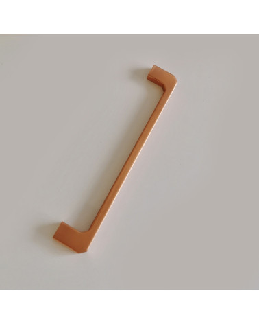 CAMPANA copper furniture handle designer handle placed on a grey surface
