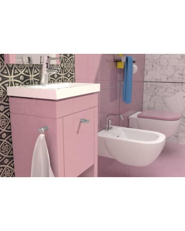 CARTAGENA furniture knob design handle fitted on a pink cabinet in a bathroom