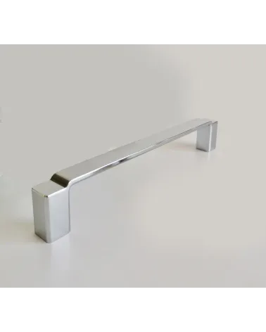Polished chrome AMARO furniture handle design handle presented on a grey background