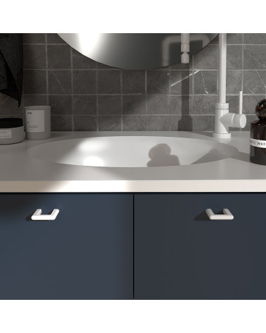 Glossy white NOX furniture handle design handle fitted on a bathroom cabinet