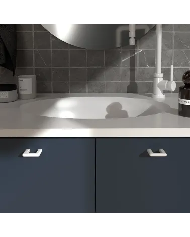 Glossy white NOX furniture handle design handle fitted on a bathroom cabinet