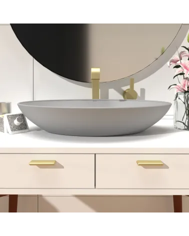 NOX-1 matte gold furniture handle designer pull mounted on a bathroom cabinet