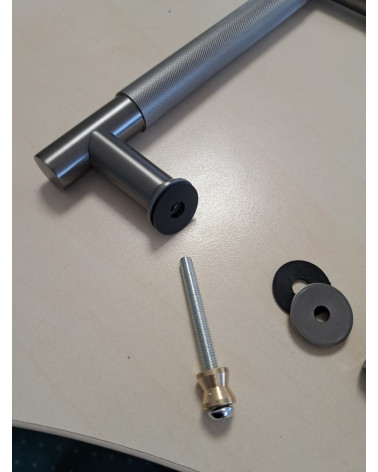 Textured double pull handle for door 1770 anthracite finish designer handle fitted on a grey background