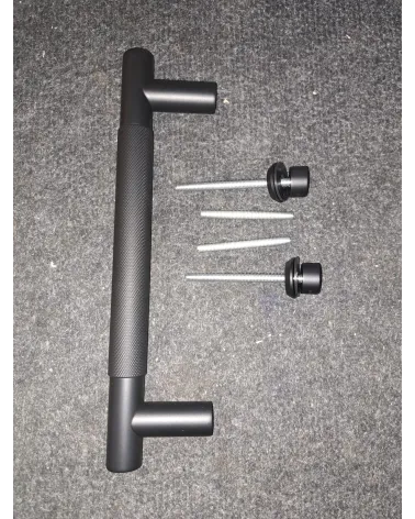 Textured single pull handle for door 1770 anthracite finish designer handle fitted on a grey surface