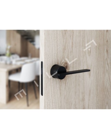 JUMELLE black door handle designer handle front view mounted on ajar door