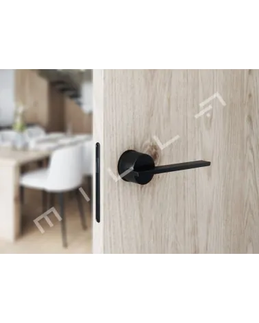 JUMELLE futuristic door handle designer handle front view mounted on ajar door