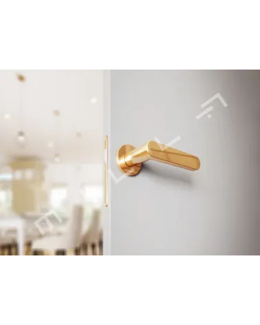 Matt gold ALORA door handle designer handle bottom view mounted on a door