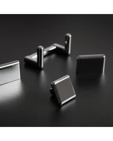 Titanium furniture knob NOX design handle presented on a dark surface