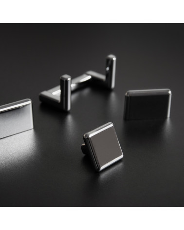Titanium furniture knob NOX design handle presented on a dark surface