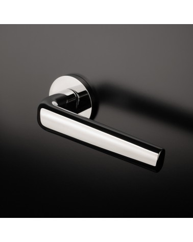 INULLA chrome designer door handle mounted on a door