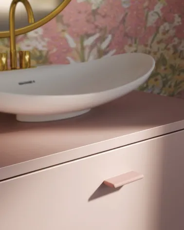 Powder pink NOX-1 furniture handle designer handle mounted on a bathroom cabinet