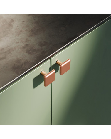 Copper NOX furniture knob designer handle fixed on a cabinet