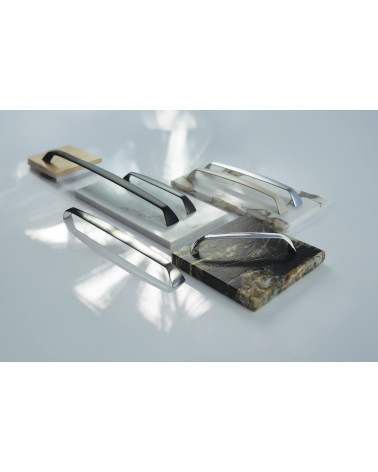 SONGO furniture handle designer handle displayed on plates
