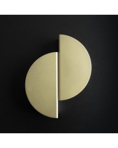 ZORIA matt gold furniture handle design handle placed on a dark background