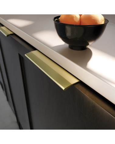 Gold anode furniture handle COSTA design handle close-up view mounted on a cabinet