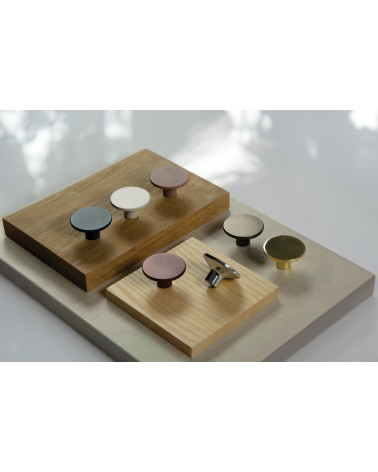 ASTRO designer furniture knob arranged on wooden plates