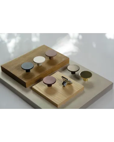 ASTRO furniture knob design handle arranged on wooden panels