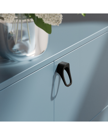 Matt black LAGO furniture knob designer handle mounted on a cabinet